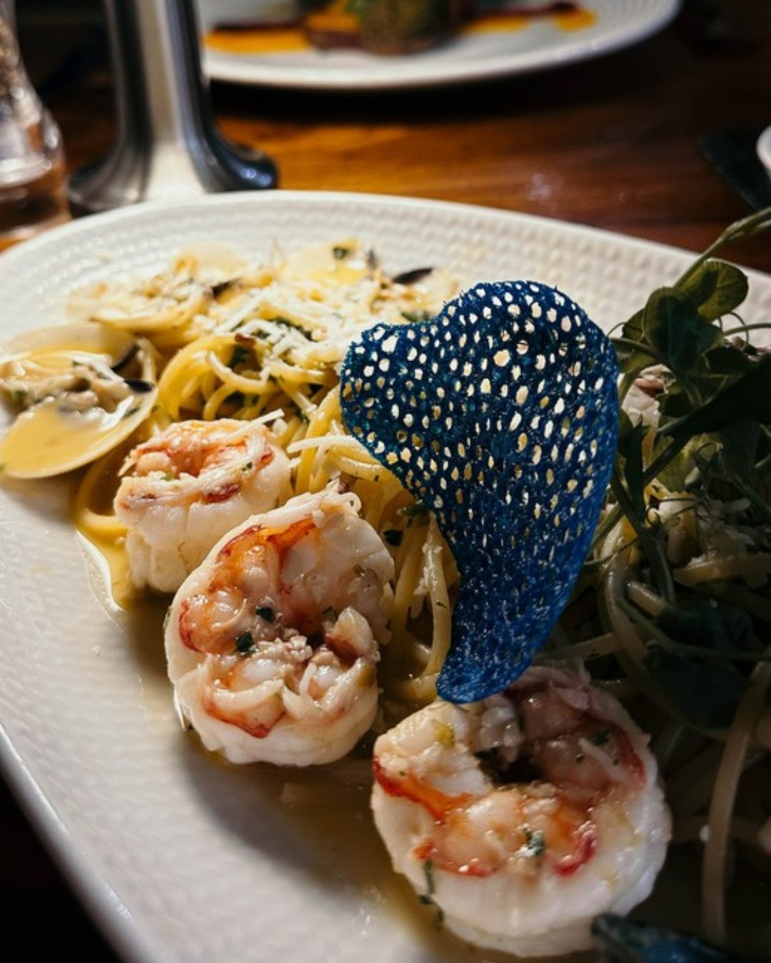 Seafood pasta with crisp garnish, slide 2